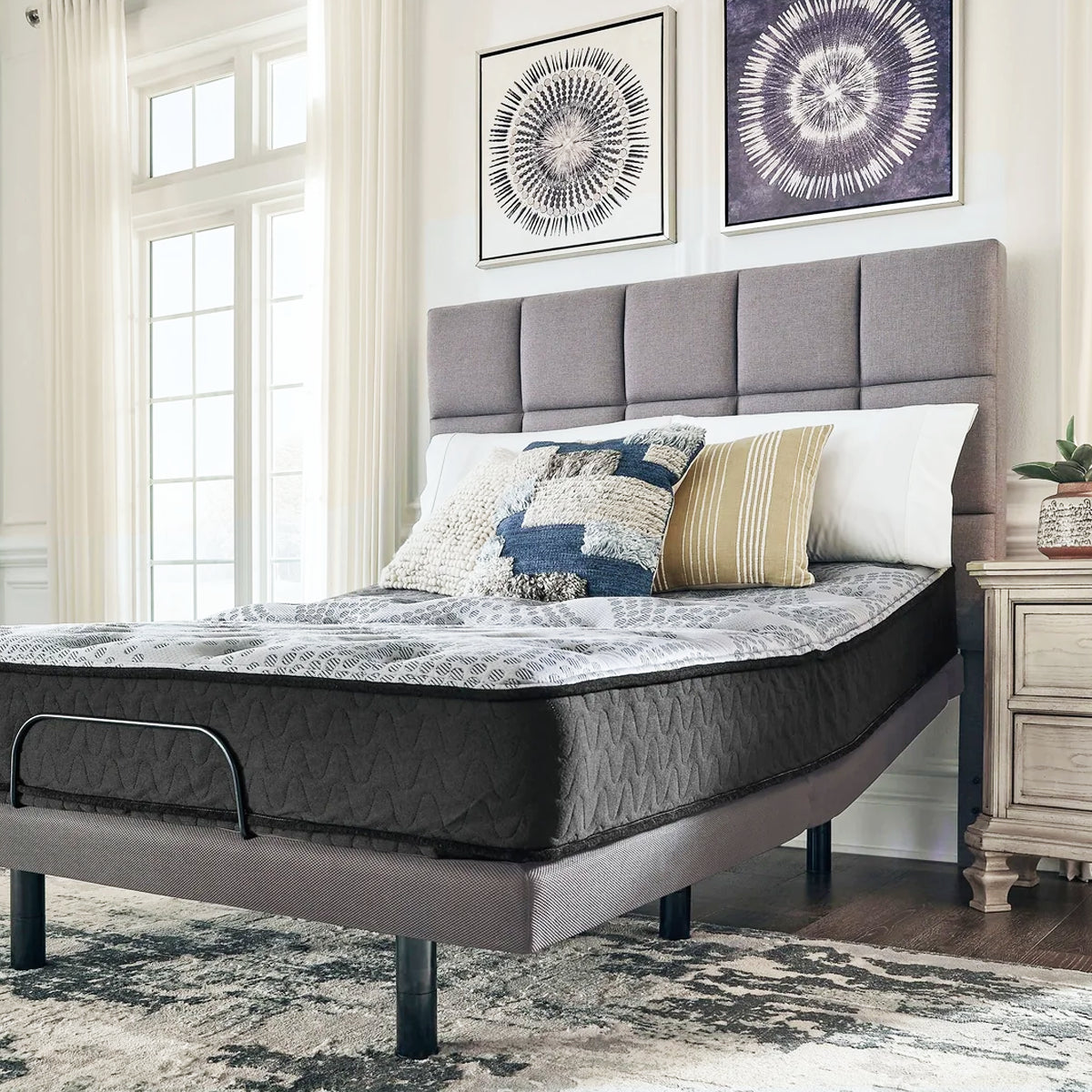 Comfort Plus 10 Inch Medium Mattress corner view on an adjustable base, showing the 10-inch supportive profile layers.
