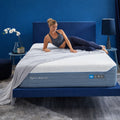 Lifestyle shot of a woman relaxing on the H6 Hybrid Performance Mattress demonstrating body contouring and comfort.