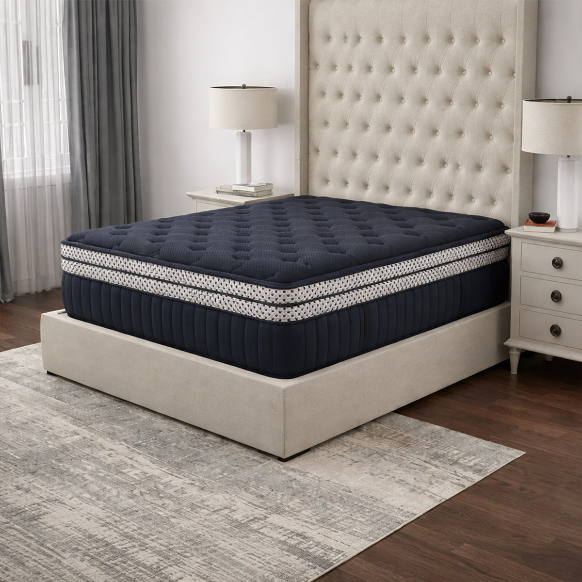 High-angle bedroom view of the WinkBeds Blue Mattress featuring a premium tufted navy double box top surface.