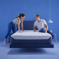 Bedroom setting with M3 Performance Modular Hybrid Mattress on a floating base showcasing customizable dual support.