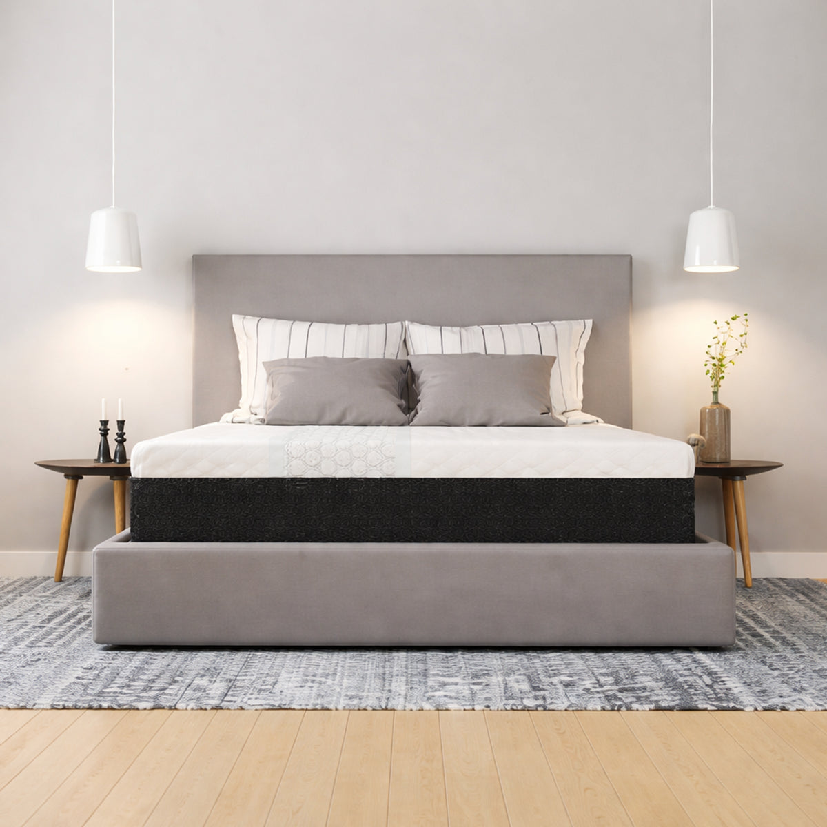 Front view of the Restore Plus Copper cooling mattress by Diamond in a bright, modern bedroom setting with grey bedding and white pendant lighting.
