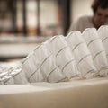 Close-up of the individually wrapped pocketed coils used in WinkBeds mattresses for breathable airflow and targeted pressure relief.

