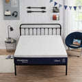 The Sleeptone Basics 10-inch adjustable comfort memory foam mattress displayed on a modern black metal bed frame in a bright bedroom setting.

