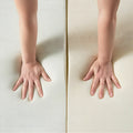 Comparison of plush and firm foam responsiveness during a hand pressure test on the Sleeptone adjustable hybrid mattress.
