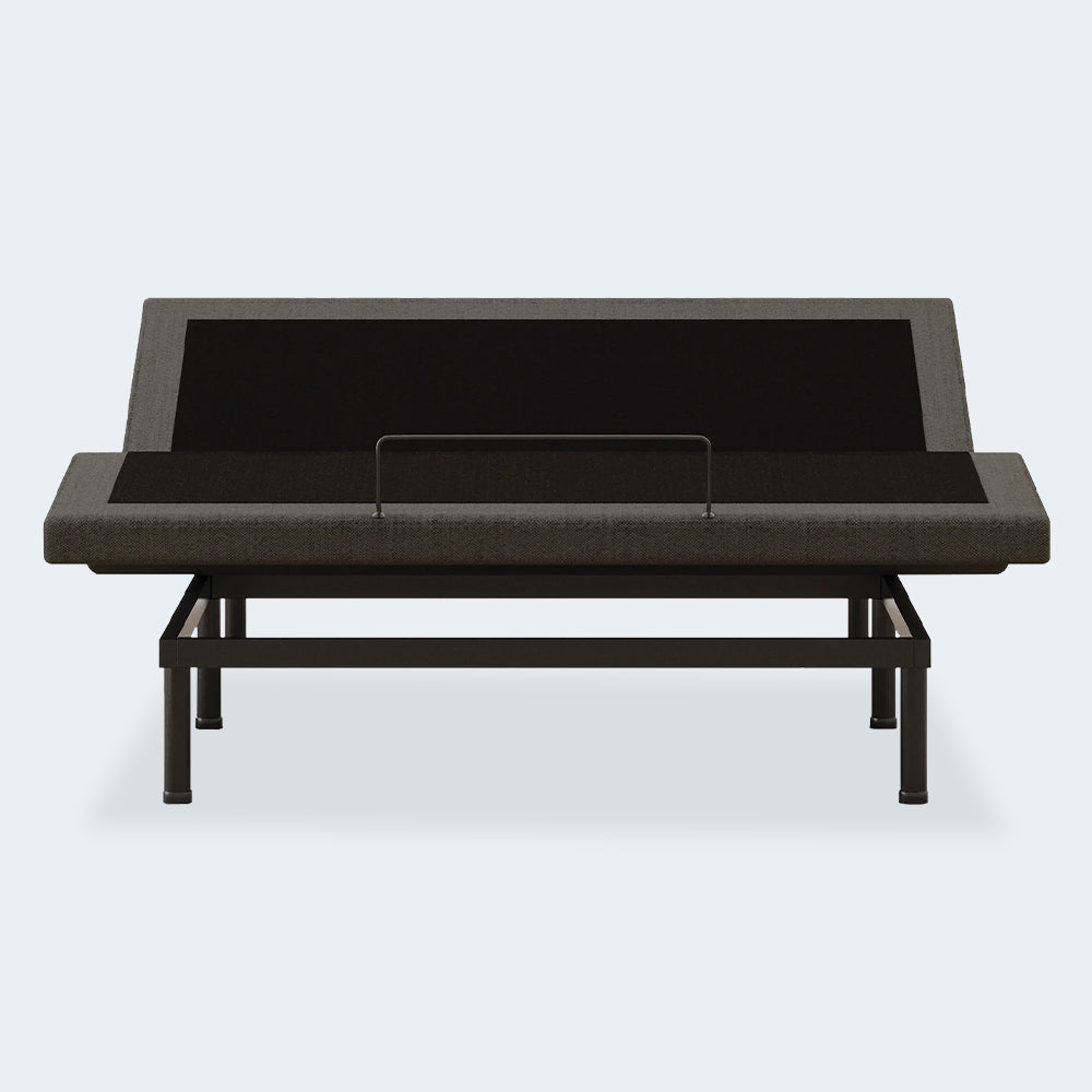 Front-facing view of the Ashley Comfort Premier steel adjustable bed foundation with the head section raised and mattress retainer bar.
