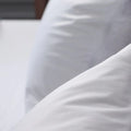 Close-up of the ultra-soft, breathable jersey fabric used in Malouf Prime pillow protectors.
