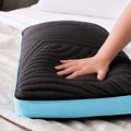 Pressure-relieving Malouf Ice Cloud memory foam pillow with textured, black cooling Omniphase cover.
