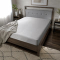 BEDGEAR Dri-Tec waterproof mattress protector on a modern bed for maximum protection and comfort.
