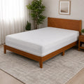 BEDGEAR Stretchwick 6-sided mattress encasement on a wood bed frame for complete waterproof protection.
