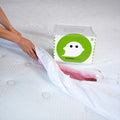 Waterproof GhostBed mattress protector blocking wine spills to keep your bed clean and stain-free.
