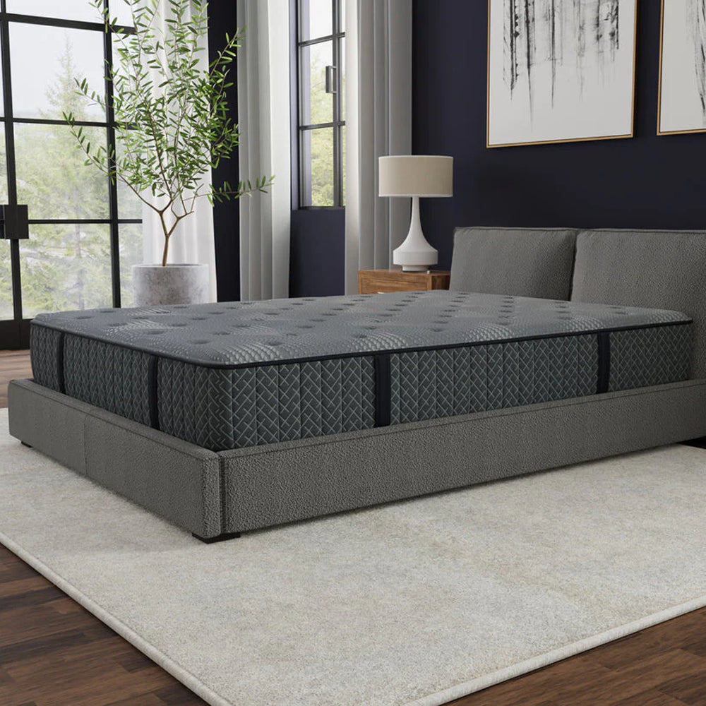 Three-quarter perspective of the Allureluxe™ Bamboo Hybrid Advanced mattress showcasing the premium charcoal grey quilted fabric and thick 10-inch profile.
