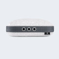 Portable BEDGEAR Storm travel pillow case secured to a suitcase handle for easy commuting and travel.
