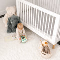 BEDGEAR Air-X crib mattress protector on a crib mattress in a nursery, offering a breathable, safe sleep.

