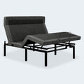iDealBed Smart 4iT adjustable motorized bed base showing articulated head and foot sections with grey fabric upholstery.

