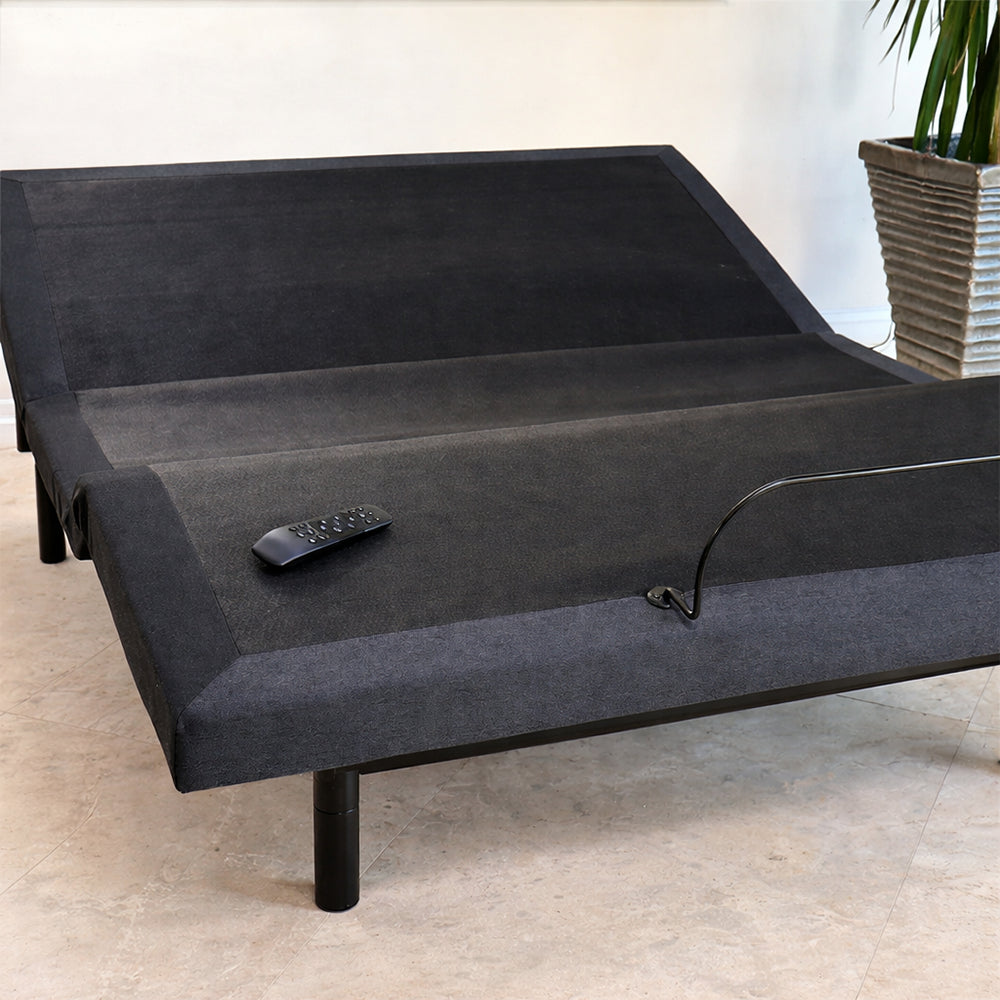 Customatic Dreamsense The Harmony wireless adjustable base showing head elevation with the remote control.
