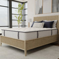 Three-quarter angle of the Sofinity Hybrid Signature firm 12-inch mattress highlighting its deep supportive profile and textured side panels.
