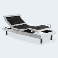 Three-quarter perspective of the Malouf Structures S755 adjustable base showing articulated head and foot sections with light grey upholstery.
