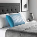 Ergonomic Malouf Zoned Gel Dough pillow on a bed, featuring perforated cooling holes for neck and head support.