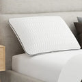 South Bay reactive memory foam pillow on a bed, featuring a breathable chevron cover for cooling comfort.
