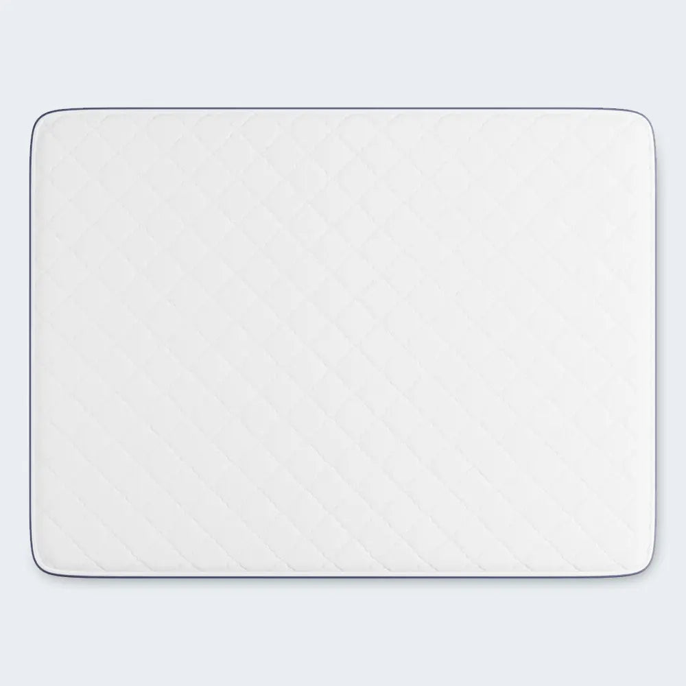 White quilted surface of the Serta Perfect Day 7 inch firm mattress providing breathable comfort.
