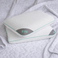 Stacked BEDGEAR Rise Performance pillows featuring the breathable gray mesh corner and supportive design.
