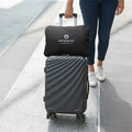 Travel suitcase with BEDGEAR Flow Performance Travel Pillow case secured to the handle for easy transport.
