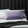 Lavender-infused Malouf ActiveDough pillow on a bed, designed for aromatherapy and ergonomic neck support.
