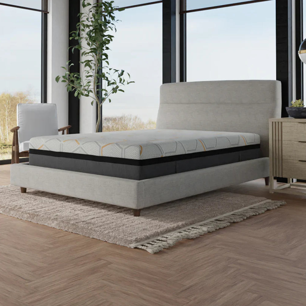 Three-quarter view of the 14-inch plush hybrid mattress by South Bay featuring a decorative geometric quilted cover with copper accents.
