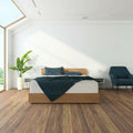 Minimalist bedroom with the Sleep Fresh 12 inch medium firm mattress by Corsicana on a wooden platform bed.
