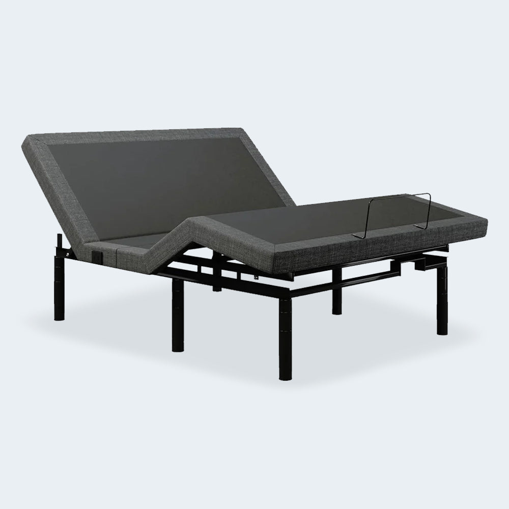 Three-quarter perspective of the iDealBed Smart 5i adjustable bed frame showing head and foot elevation with charcoal grey upholstery.
