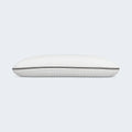 Side view of a supportive bamboo charcoal memory foam pillow with a plush quilted cover for neck alignment.
