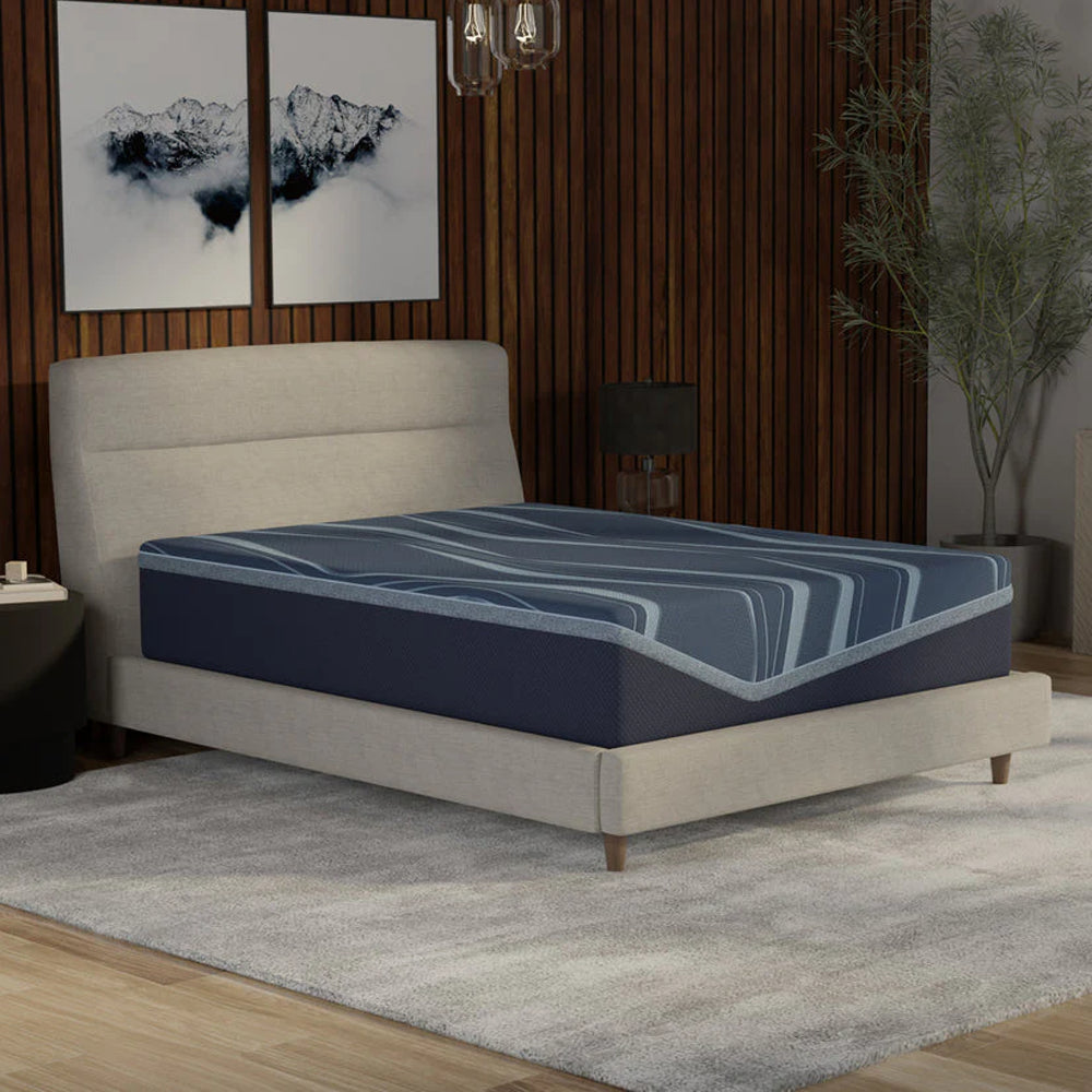 Angled view of the ActiveAlign 14-inch Reactive Copper hybrid mattress showcasing the thick foam-encased profile and wavy blue cooling cover.
