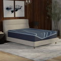 Angled view of the ActiveAlign 14-inch Reactive Copper hybrid mattress showcasing the thick foam-encased profile and wavy blue cooling cover.
