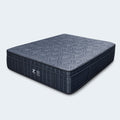 Isolated angled view of the Phantom Lux 16-inch tight-top medium mattress showing its high-profile design and grey geometric surface pattern.
