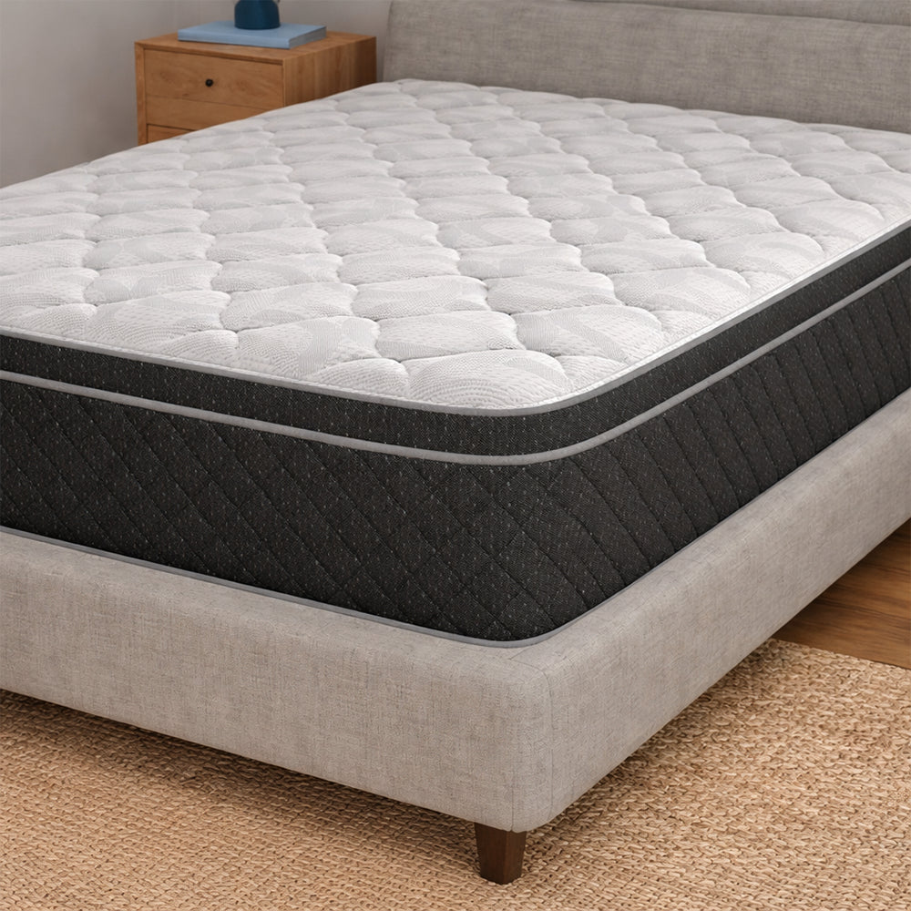 Perspective studio shot of the Griffin 14" Hybrid Mattress showing the thick 14-inch luxury profile and diamond quilted cooling top.
