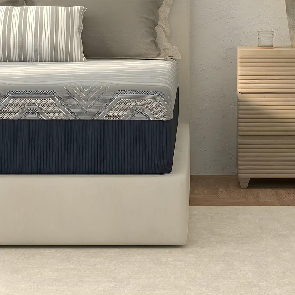 Profile view of the American Bedding Isotonic Percy Plush Hybrid Mattress showing the thick comfort layers and durable navy blue fabric upholstery.
