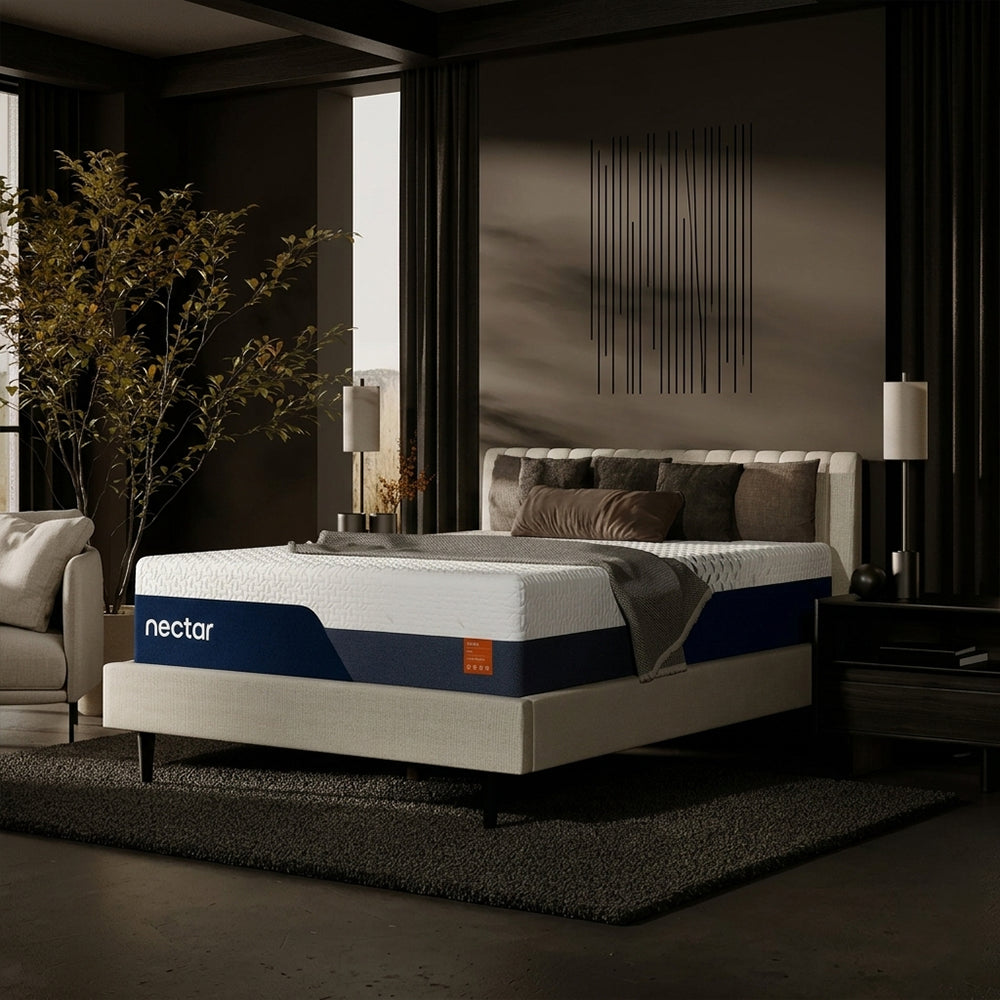 Angled perspective of the Nectar Ultra 15-inch mattress on a minimalist upholstered bed frame in a high-end designer master bedroom.
