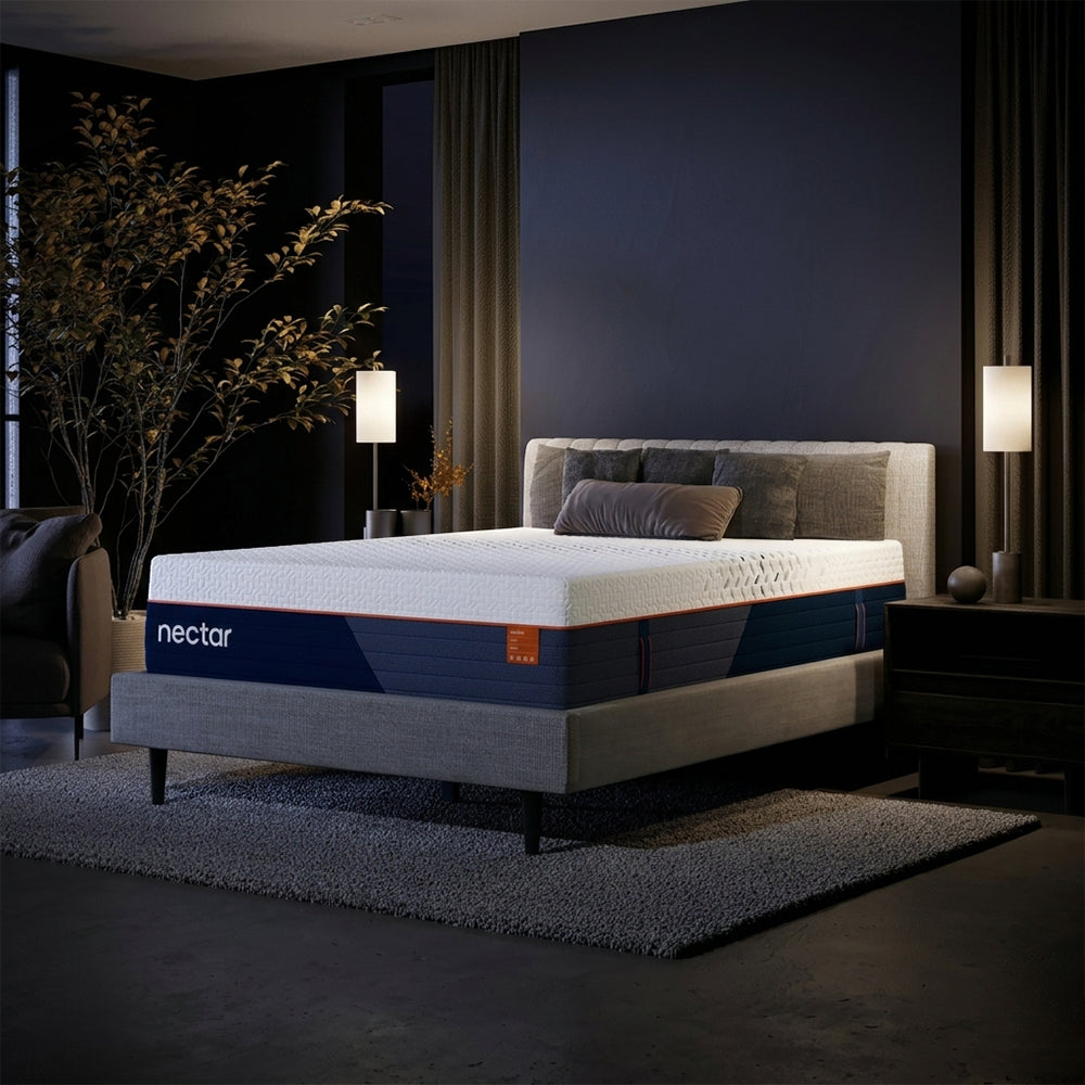 Modern luxury bedroom interior featuring the Nectar Ultra Hybrid Medium-Firm Mattress styled on a grey upholstered bed frame with designer decor.
