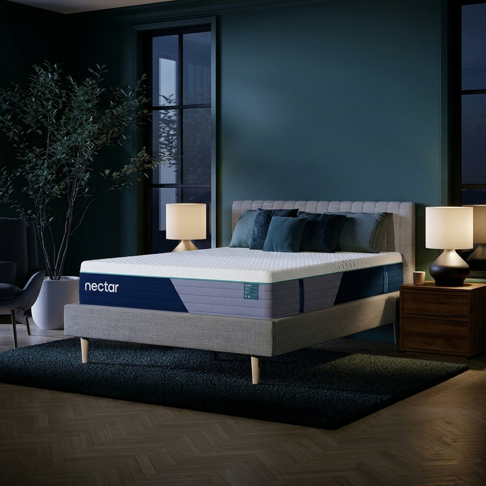 Modern bedroom interior featuring the Nectar Premier Hybrid 13-inch Medium Firm Mattress styled on a contemporary upholstered platform bed frame.
