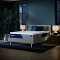 Modern bedroom interior featuring the Nectar Premier Hybrid 13-inch Medium Firm Mattress styled on a contemporary upholstered platform bed frame.
