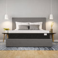 Response Copper cool hybrid mattress in a contemporary bedroom setting on a grey upholstered frame.