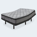 Head elevated view of the Augusta 12 inch Firm Pillow Top Mattress resting on a black metal adjustable base.