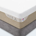 Close-up corner of a plush memory foam mattress highlighting copper infused memory foam and silk foam technology.