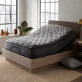Luxury master bedroom styled with a Corsicana Nights Bridge 12-inch plush mattress on a mid-century modern wooden bed frame.
