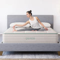 Woman stretching on the supportive Sage Organic Latex hybrid mattress, demonstrating the stable surface and medium-firm comfort of Diamond Mattress.
