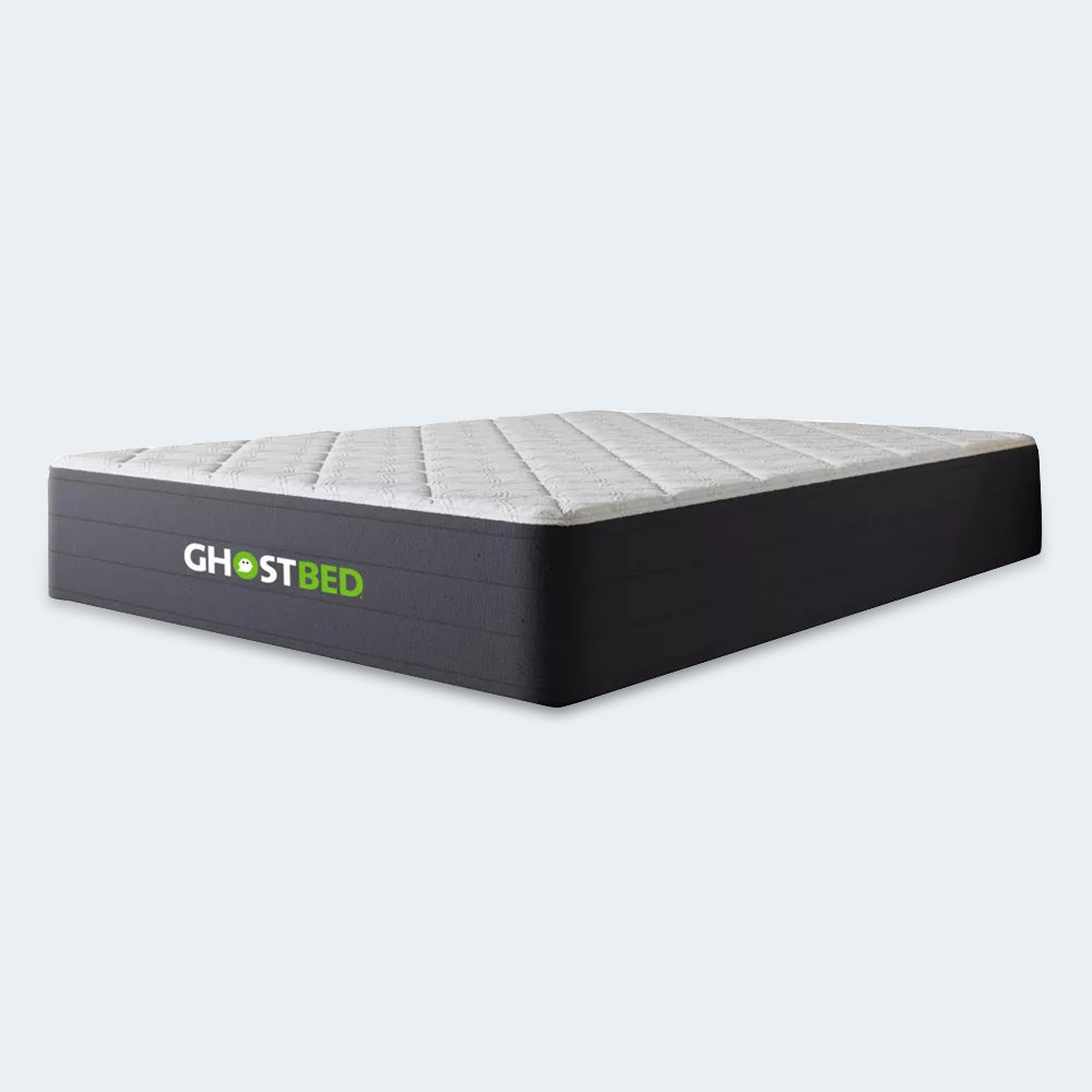 Three-quarter angled profile of the GhostBed 12-inch Hybrid mattress highlighting the luxury construction and supportive coil base.
