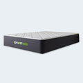 Three-quarter angled profile of the GhostBed 12-inch Hybrid mattress highlighting the luxury construction and supportive coil base.
