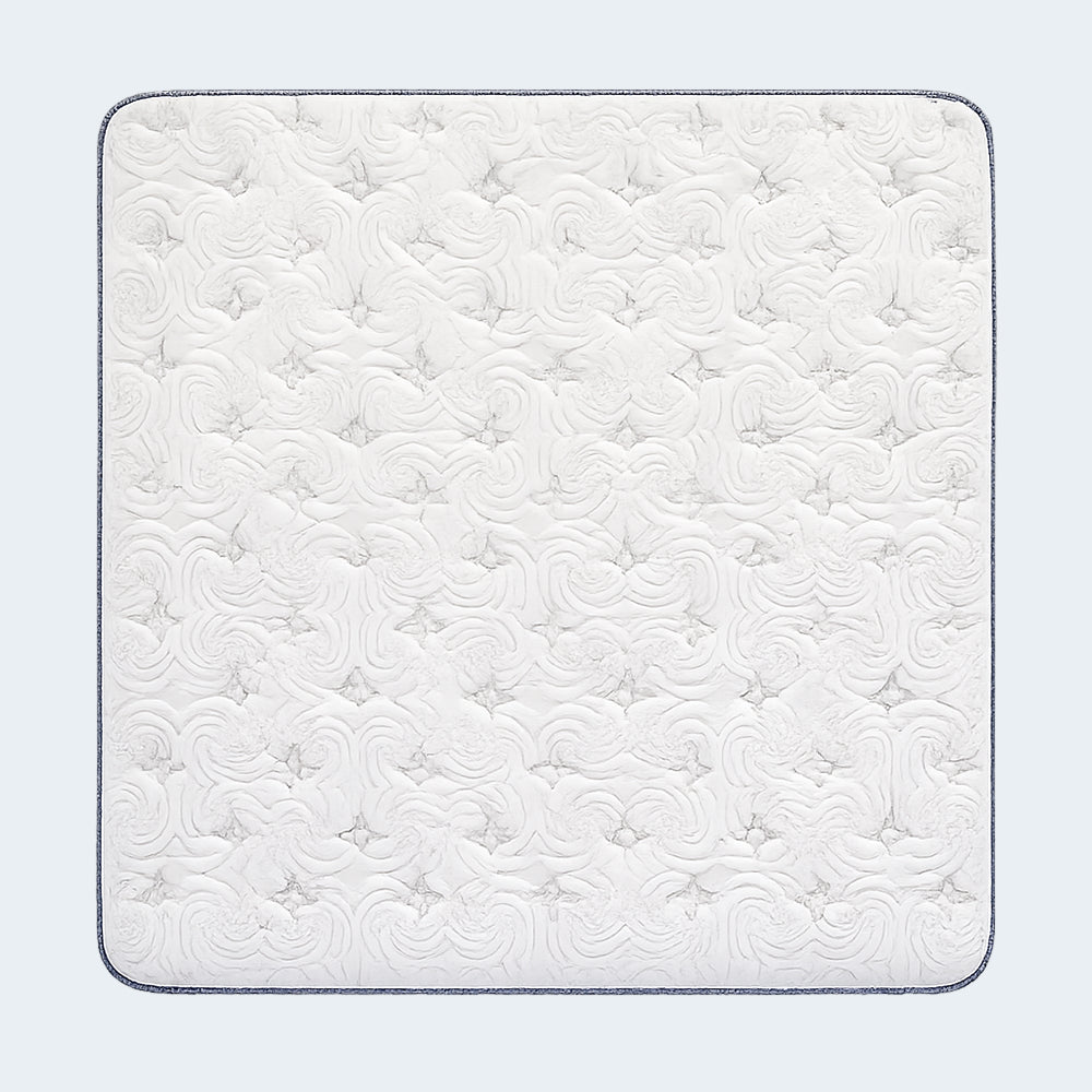 Overhead view of the Americanstar Bluesky Lux Box Top Mattress highlighting the elegant swirl quilting pattern on the breathable white surface.
