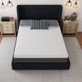 High-angle shot of the Lavender 12-inch mattress showing the breathable geometric patterned white cover on a black platform bed.
