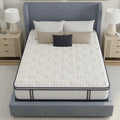 High-angle view showing the white tufted quilted surface of the South Bay Sofinity Hybrid Signature mattress on a contemporary blue bed frame.
